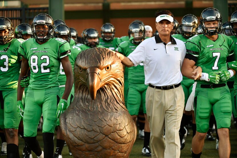 North Texas interim head coach Mike Canales touches Spiriki as the Mean Green take the field...