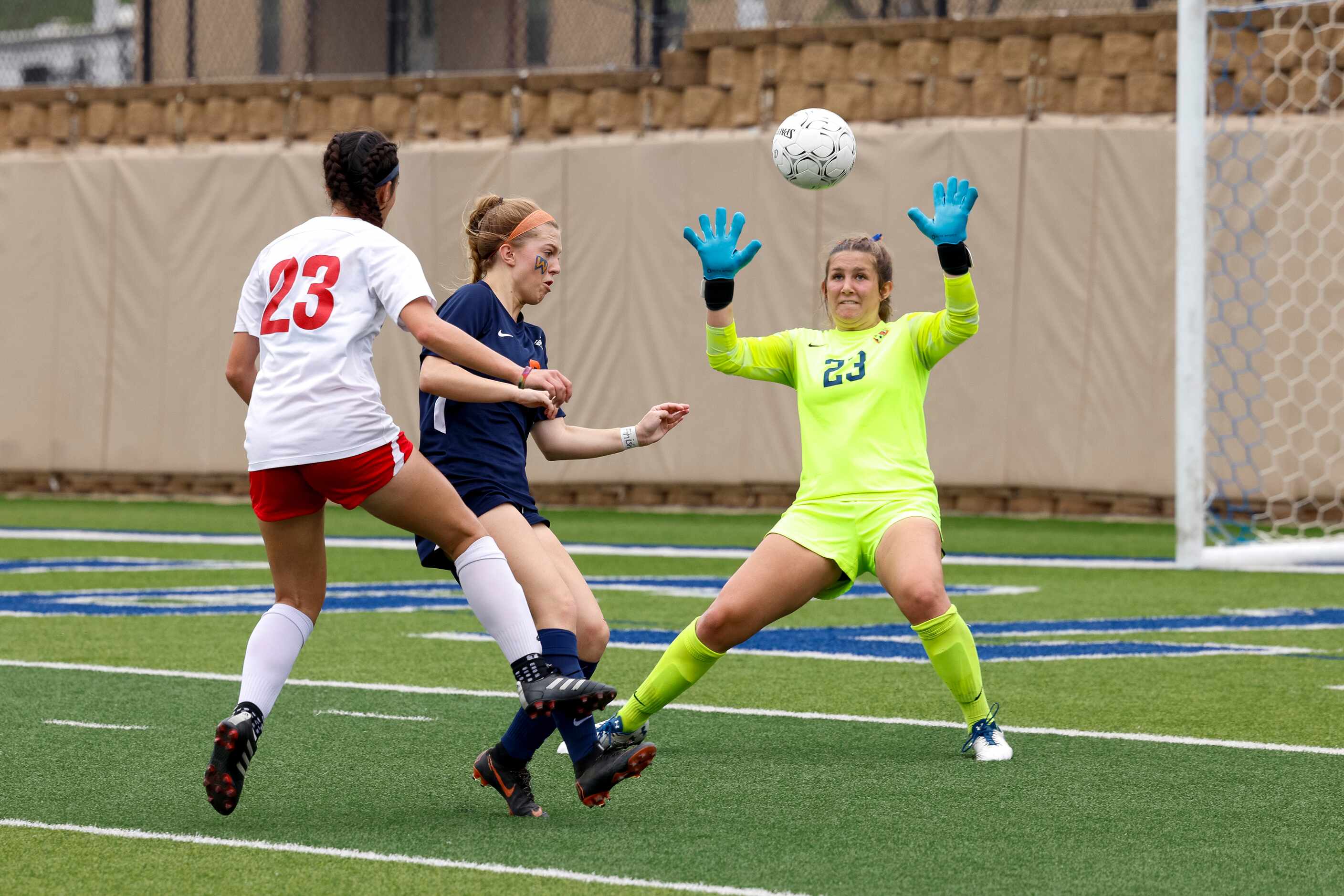 Grapevine forward Olivia Nevin (23) attempts to chip the ball over Frisco Wakeland...