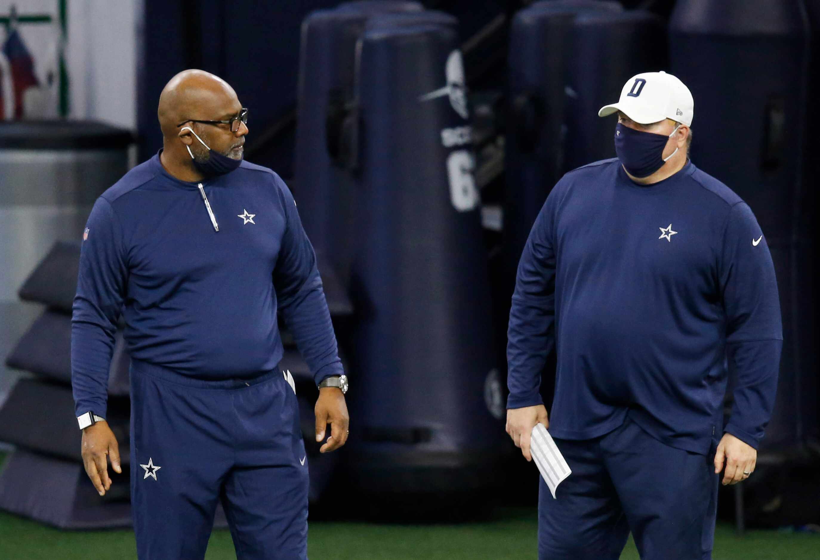 Dallas Cowboys assistant head coach Rob Davis talks with Dallas Cowboys head coach Mike...