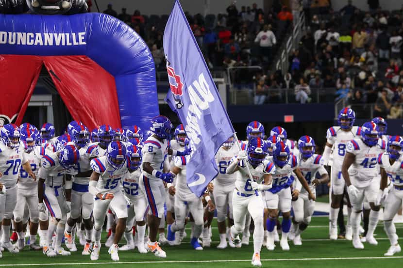 Duncanville players run out before the Class 6A Division I state championship game against...