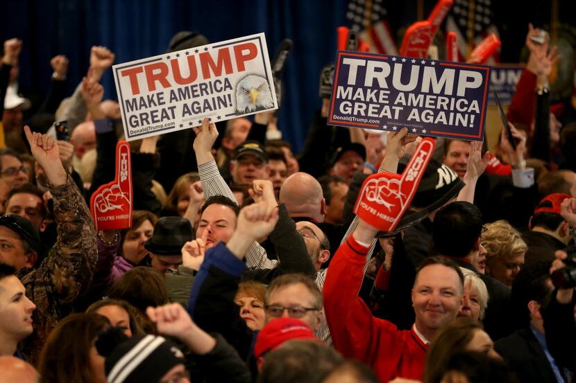  Supporters cheer for Donald Trump during a New Hampshire Primary Night Gathering In...