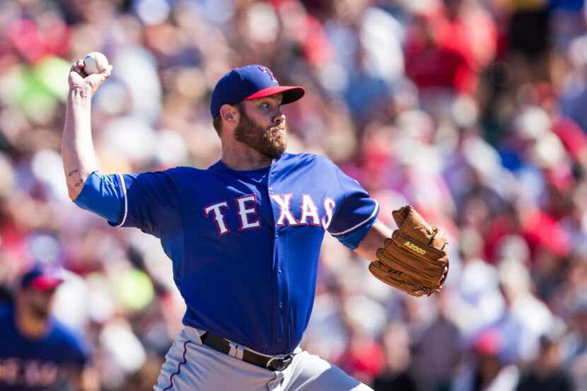 TEMPE, AZ - MARCH 10: Colby Lewis #48 of the Texas Rangers pitches during a spring training...