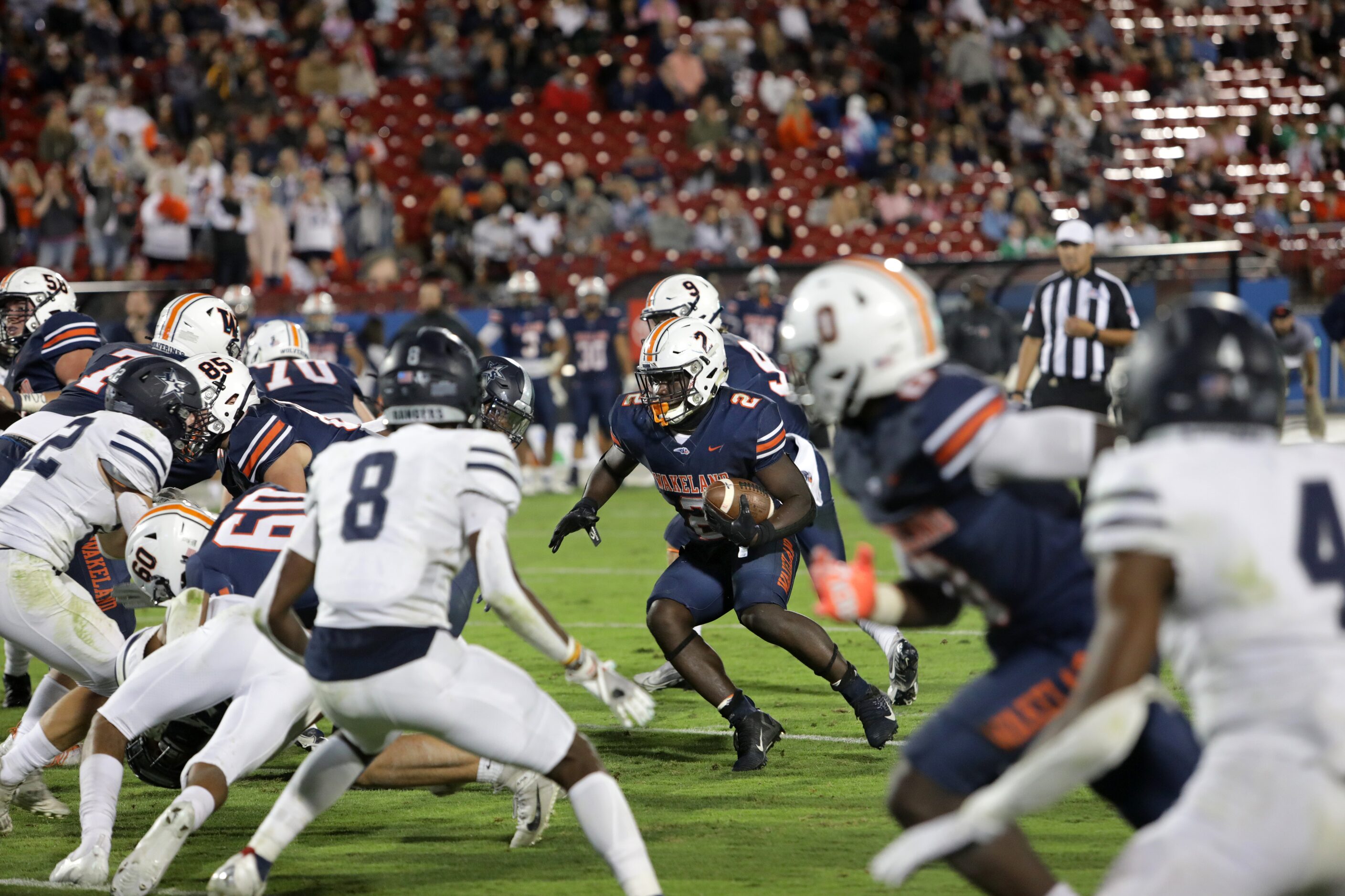 Wakeland player #2, Jared White, looks for a pocket as he carries the ball during a Frisco...