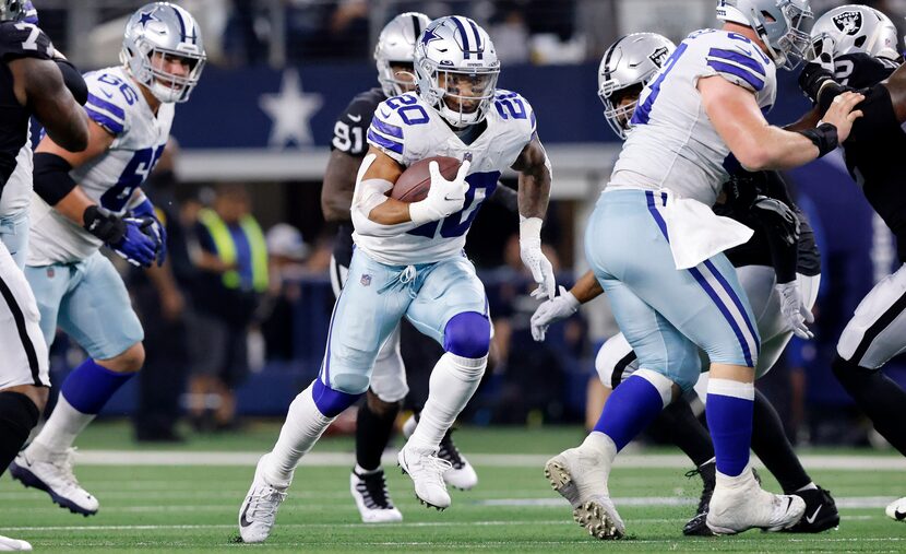 Dallas Cowboys running back Tony Pollard (20) carries the ball against the Las Vegas Raiders...