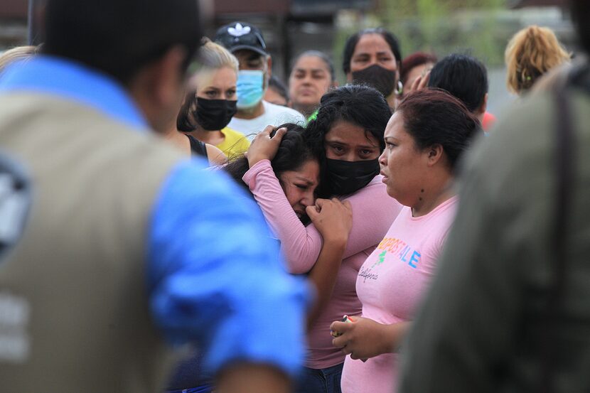 Families gathered outside the state penitentiary in Ciudad Juárez, Mexico, known as El...