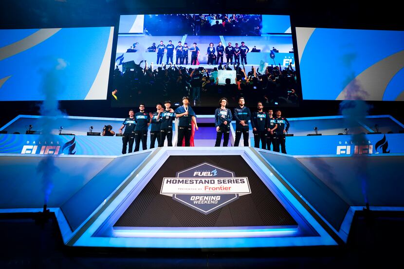 Members of the Dallas Fuel take the stage for a Overwatch League match against the Los...