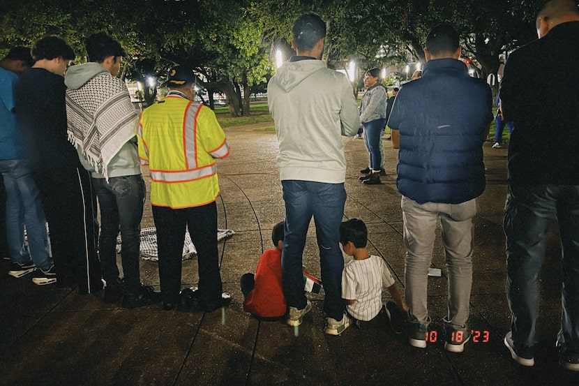 Azzam, 3, and Eesa, 5, with their father at a vigil for Wadee Alfayoumi and other...