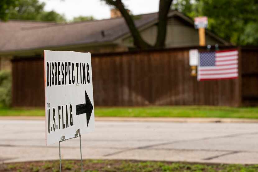 A sign outside of Brenda Drevicky's home points to her neighbor's signs on Sept. 10, 2020 in...