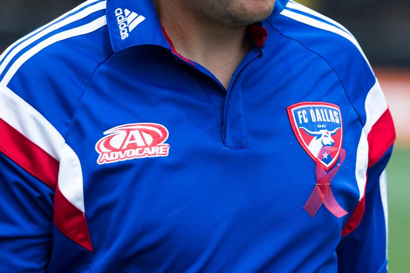 Jun 29, 2014; Columbus, OH, USA; An FC Dallas staffer wears a red ribbon honoring Lt Stu...