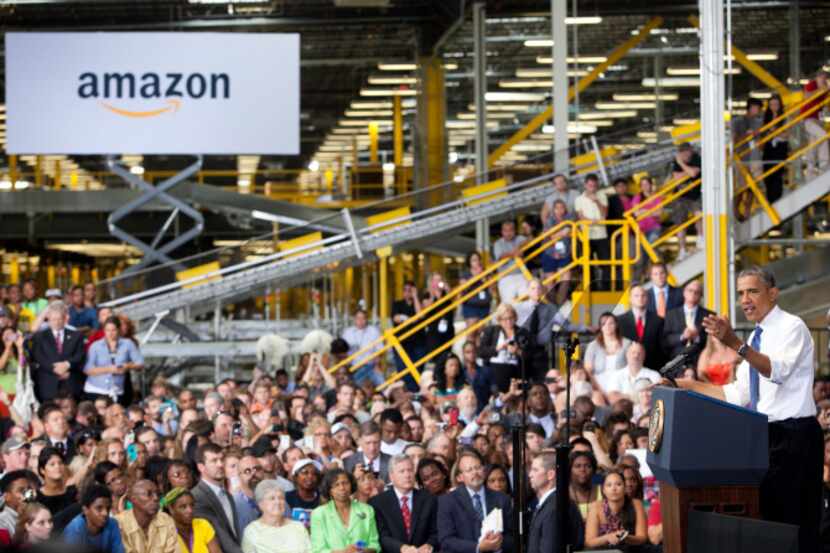 President Barack Obama speaks about the economy and jobs at an Amazon.com Fulfillment Center...