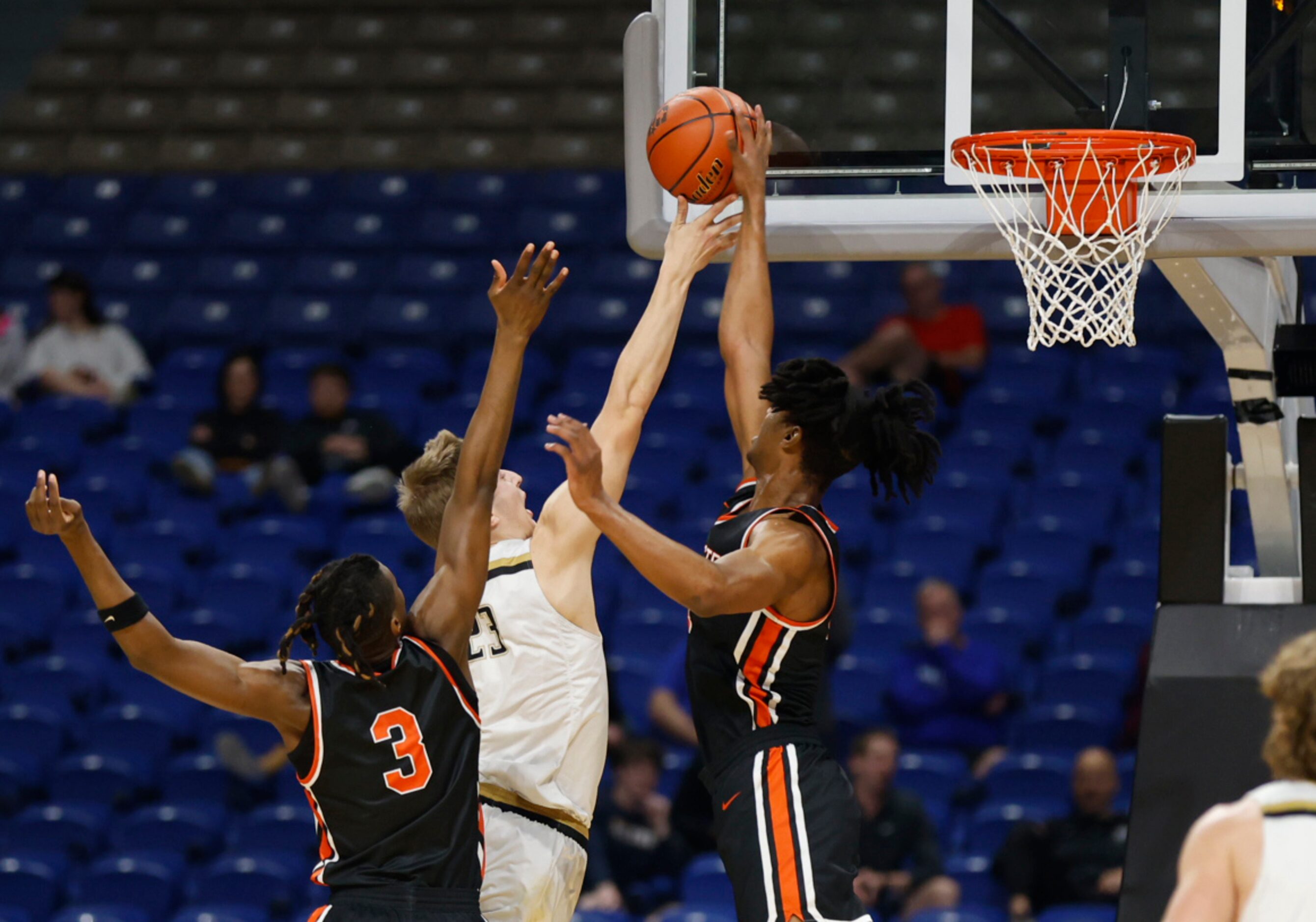 Lancaster Tigers Dillon Battie (4) blocks the shot of Amarillo Golden Sandstorm TJ Brown...