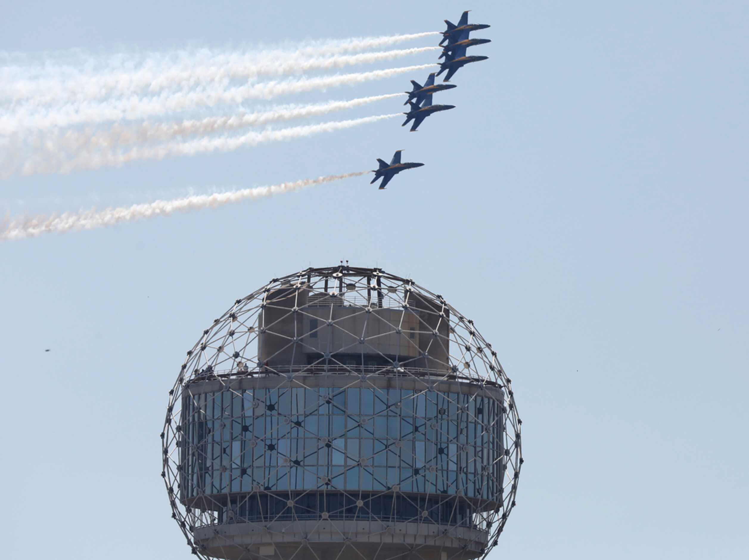 The U.S. Navy Blue Angels fly over Reunion Tower and the Dallas skyline on Wednesday, May 6,...