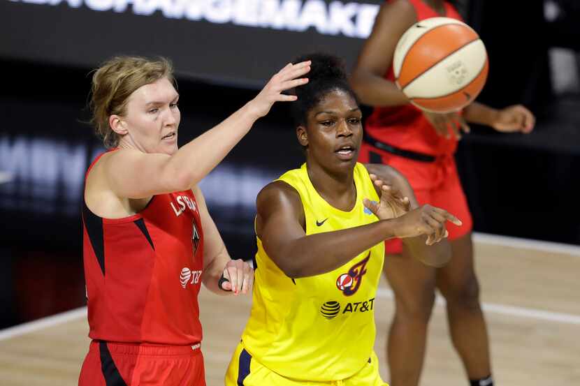 Indiana Fever center Teaira McCowan (15) pases the ball in front of Las Vegas Aces center...