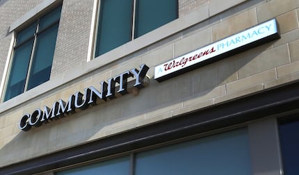 The logo at the Walgreens Community Pharmacy at 7859 Walnut Hill Lane in Dallas, emphasizes...