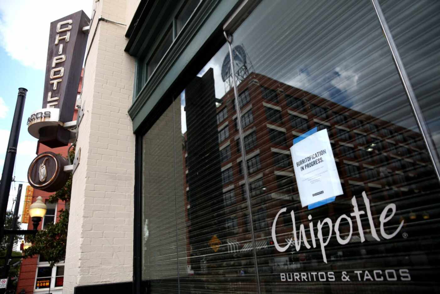 A closed for remodeling sign on the window of the Chipotle in the West End of Dallas on...