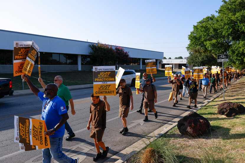 UPS employees practiced pickets along Monroe Drive in Dallas on Wednesday, July 12, 2023....