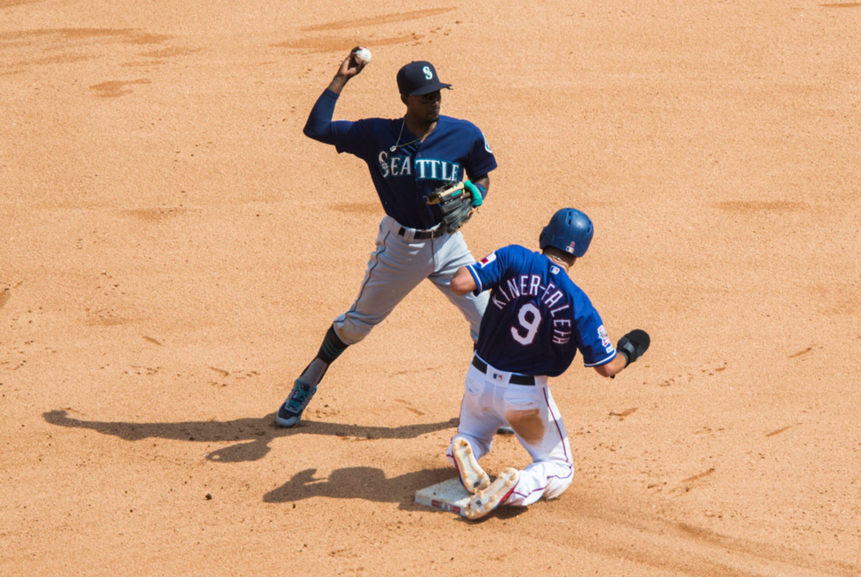 Texas Rangers third baseman Isiah Kiner-Falefa (9) is out at second as Seattle Mariners...