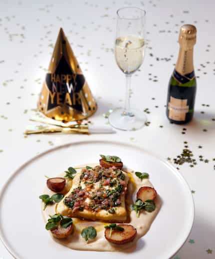 Roasted halibut with potato cream and a gremolata vinaigrette is part of the New Year's Eve...