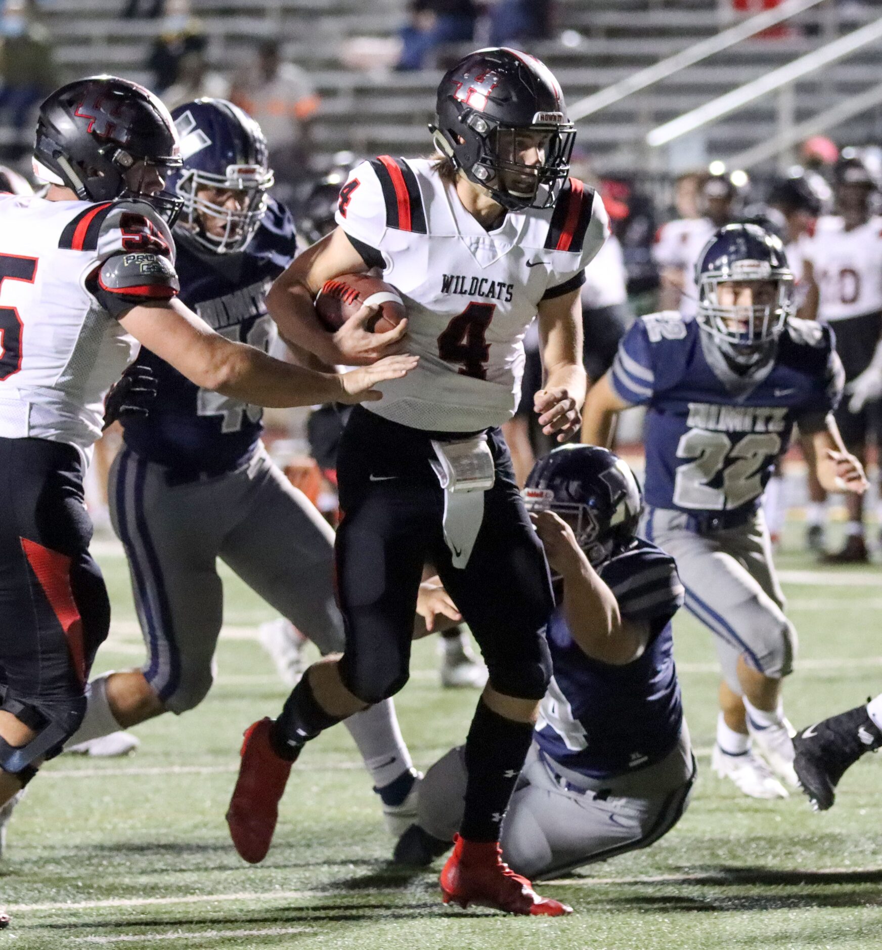 Irving Nimitz defensive lineman Mario Garcia (54) attempts to tackle Lake Highlands...