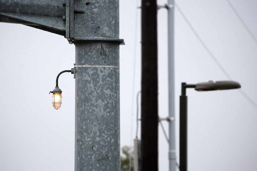 This white light affixed to a traffic stop arm at Campbell and Coit roads is one of many the...
