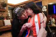 Riggel Tasayco, 20, kisses her mother Teresa Espinoza, in between a portrait session, on...