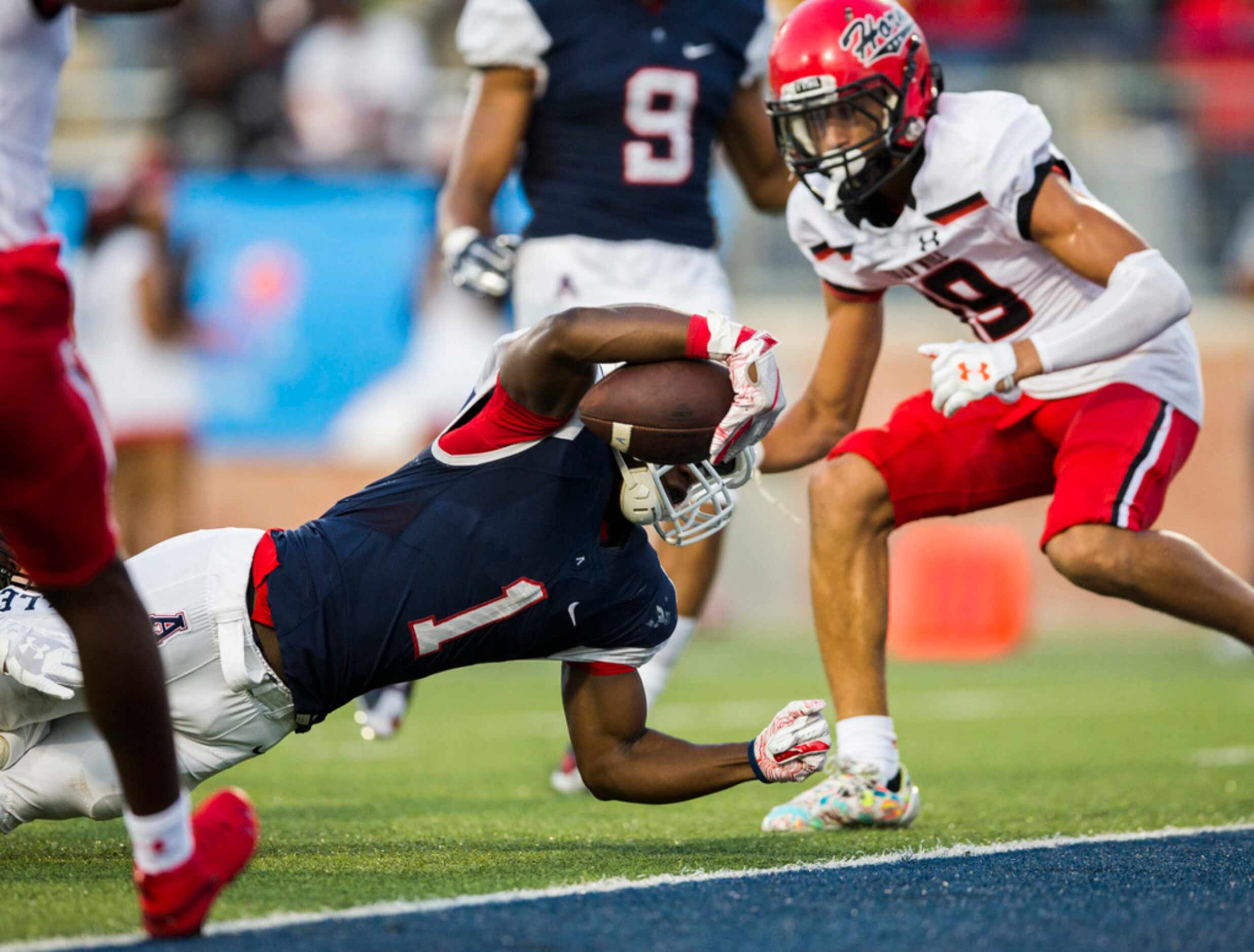 Allen running back Celdon Manning (1) reaches over the goal line for a touchdown during the...