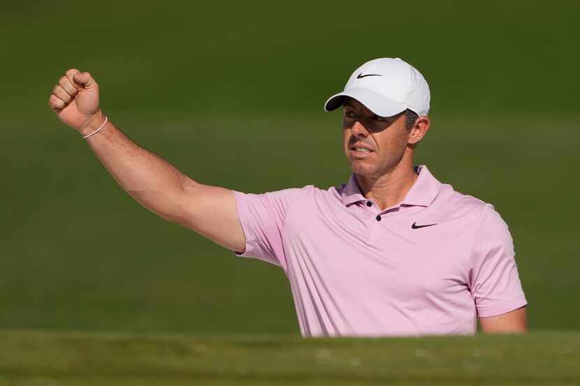 Rory McIlroy, of Northern Ireland, celebrates after an eagle on the 15th hole from the...