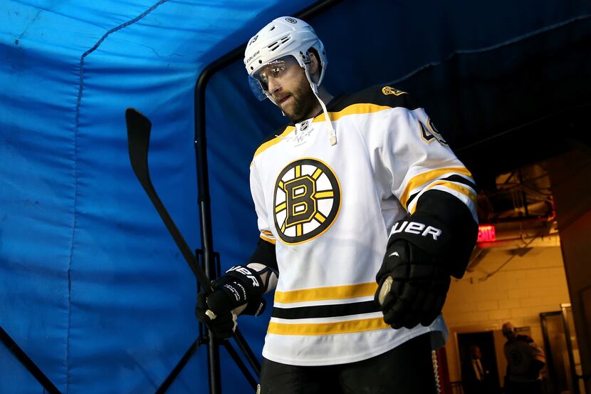 Rich Peverley (49) of the Boston Bruins walks out of the tunnel onto the ice against the New...
