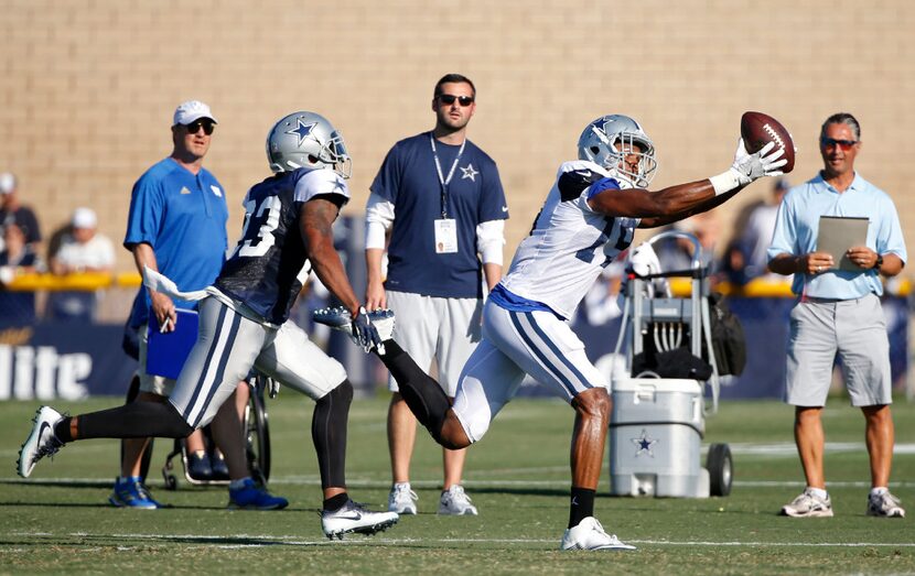 Dallas Cowboys wide receiver Brice Butler (19) catches the ball as Dallas Cowboys defensive...