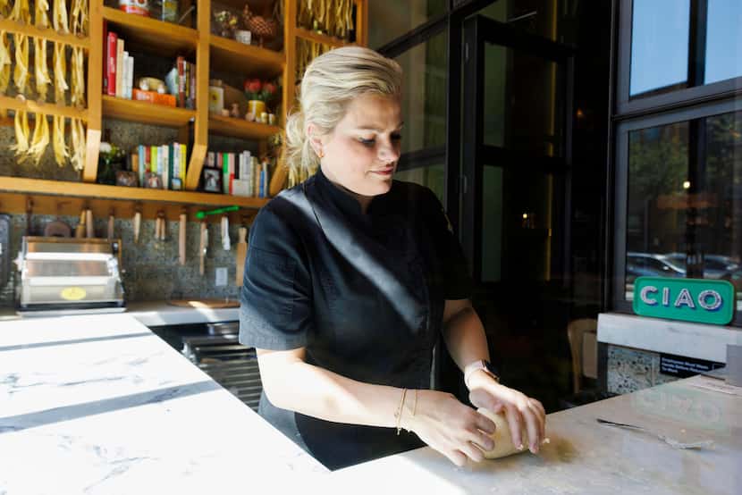 Via Triozzi owner Leigh Hutchinson kneads dough in the pasta room that faces Greenville...