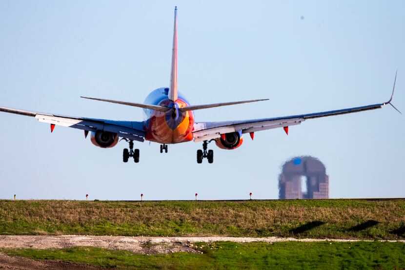A Southwest Arlines Boeing 737 jet plane lands at Love Field in Dallas on Wednesday, March...