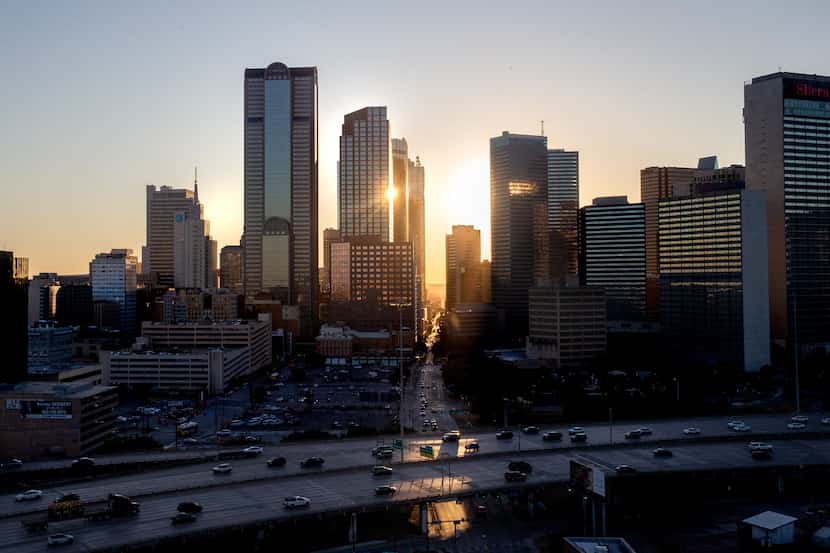 The sun sets behind the downtown Dallas skyline on Tuesday, Oct. 9, 2019.  (Lynda M....