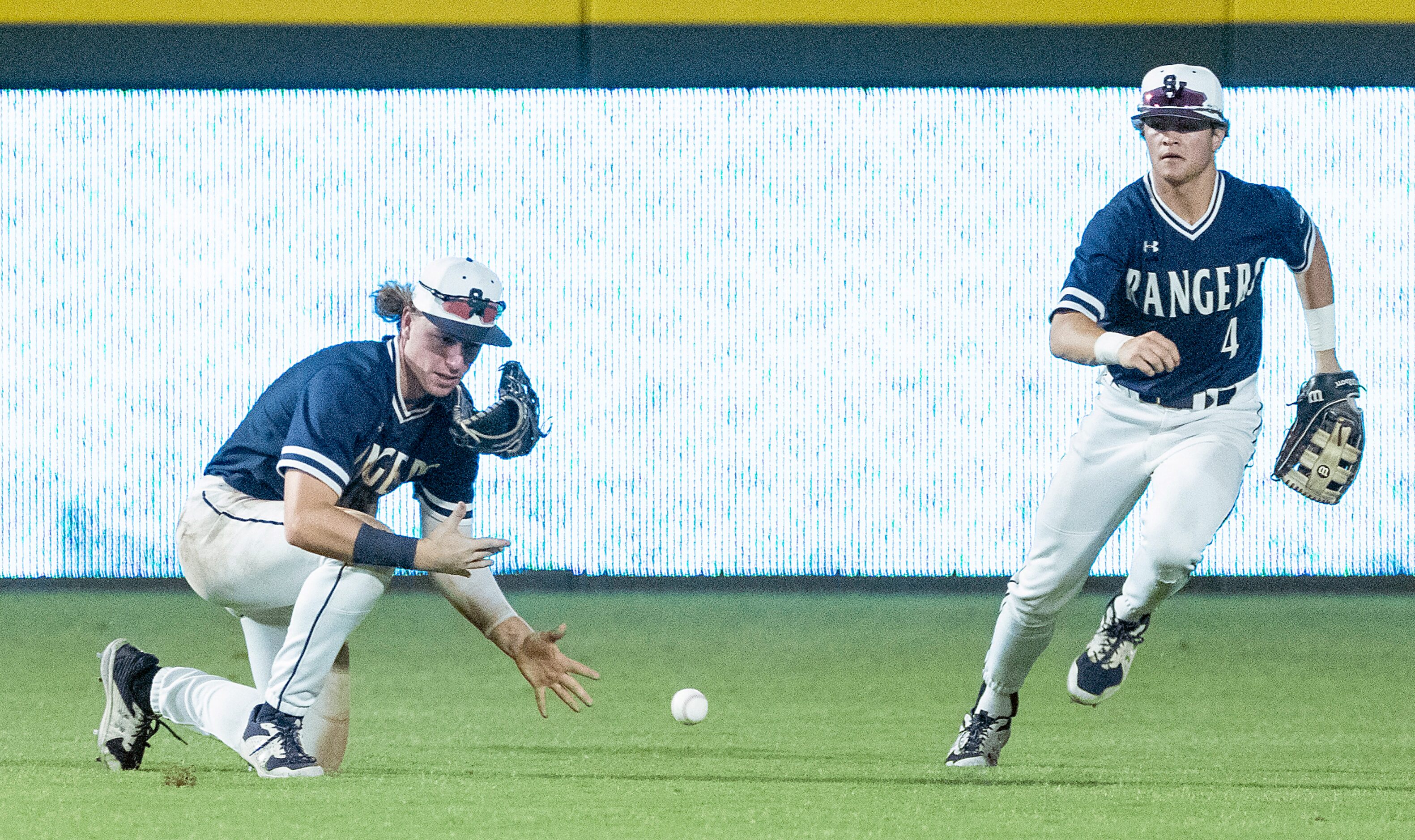 A hit by Rockwell-Heath Alex Stowers, (2), falls next to Comal Smithson Valley Kevin...