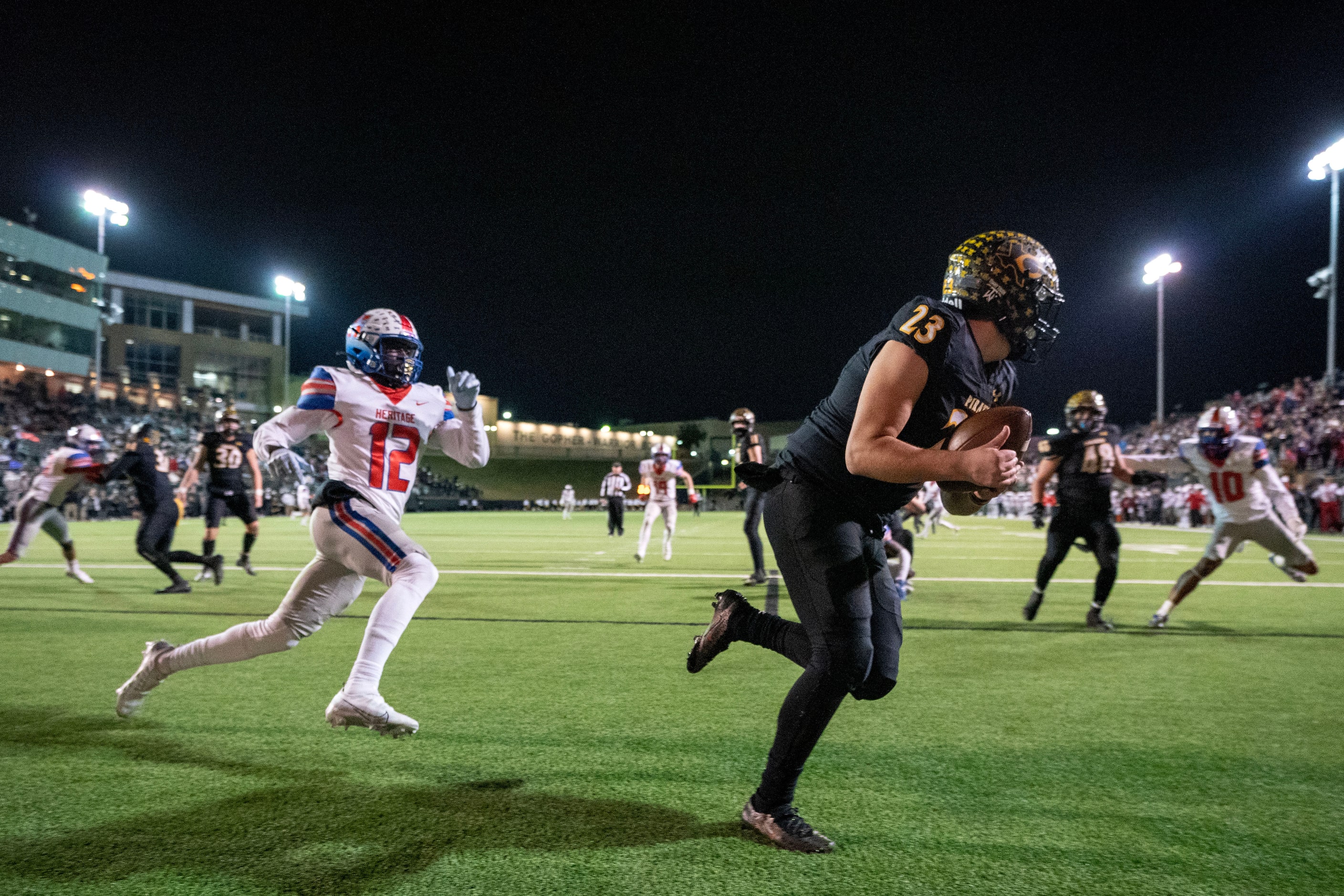 Crandall senior punter Brandon Perez (23) runs away from Midlothian Heritage senior...