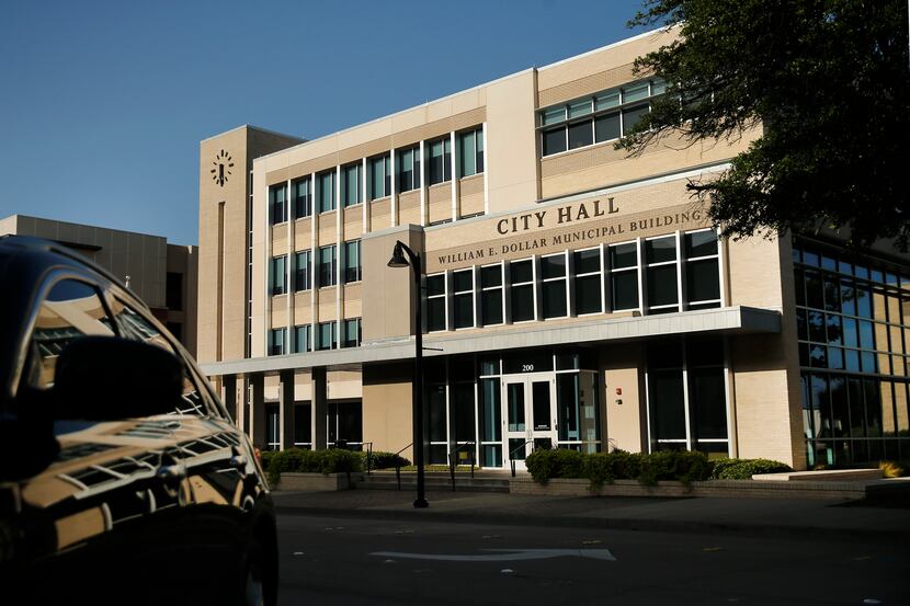 An exterior view of the William E. Dollar Municipal Building in downtown Garland, Texas is...