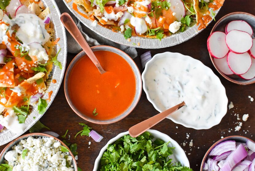 Various nacho toppings for Buffalo Chicken Nachos