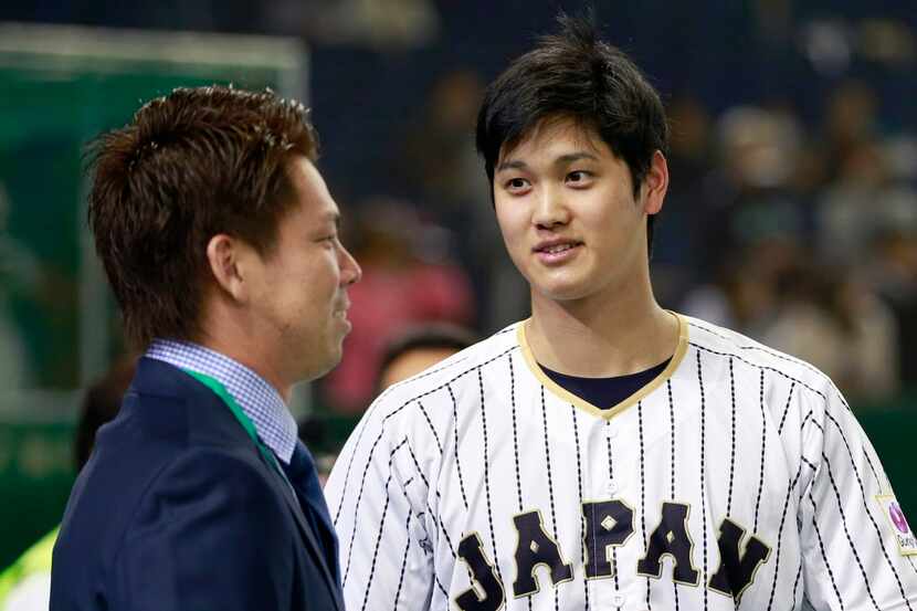 FILE - In this Nov. 10, 2016, file photo, Japan pitcher Shohei Otani, right, chats with Los...