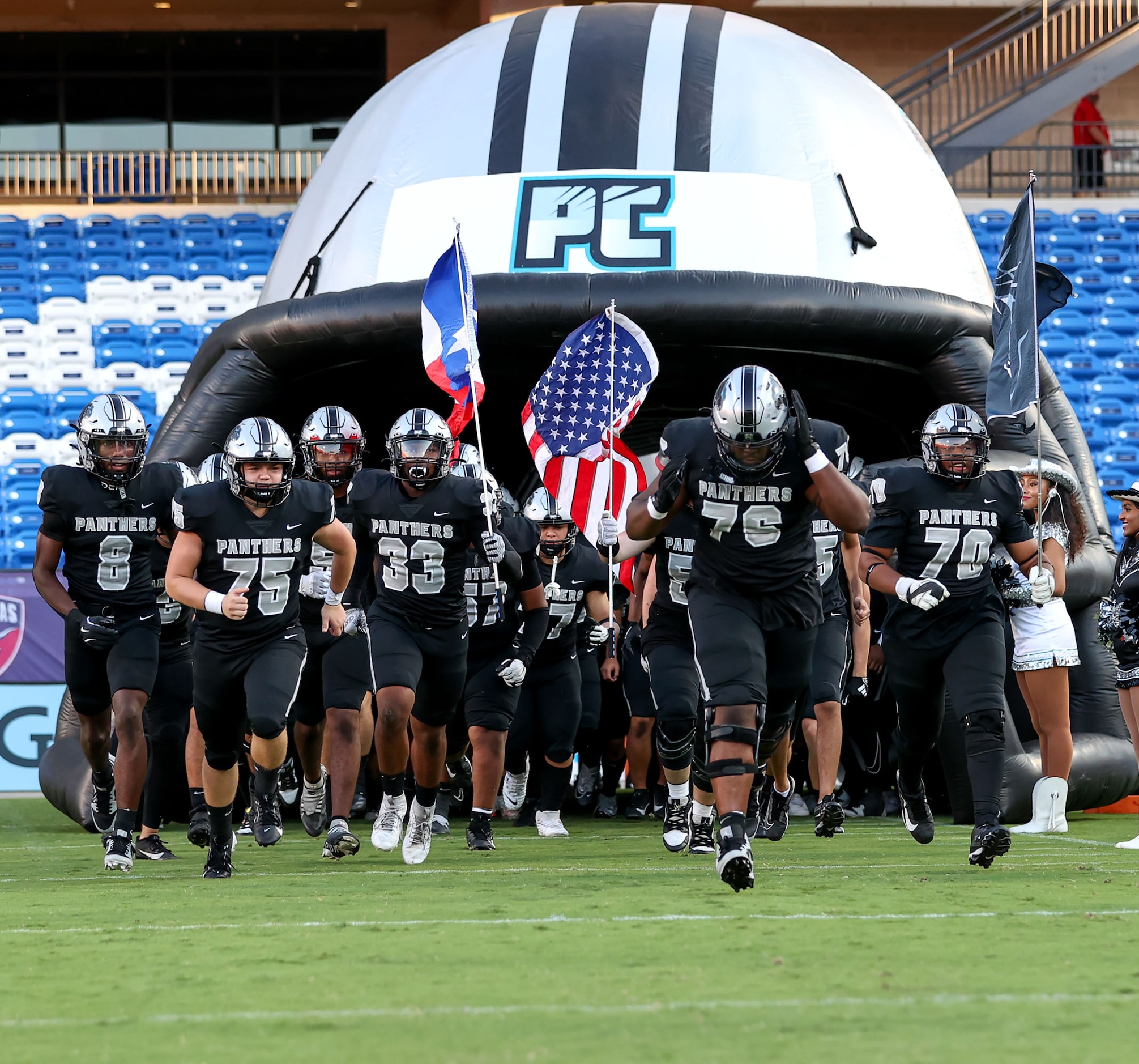 The Frisco Panther Creek Panthers enter the field to face Dallas Carter in a high school...