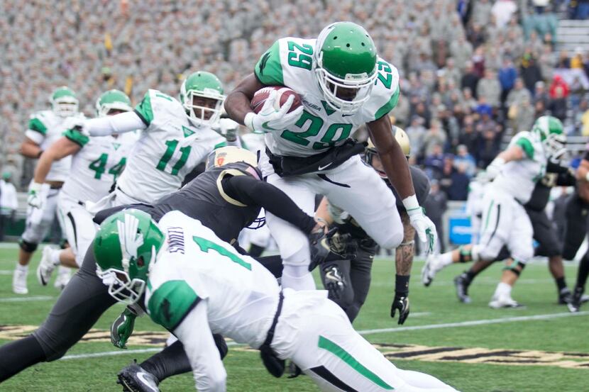 North Texas running back Willy Ivery hurdles a defender in their win against Army at Michie...