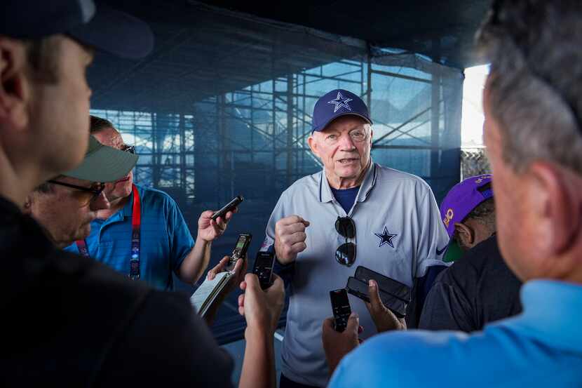 Dallas Cowboys owner and general manager Jerry Jones talks with reporters following a...