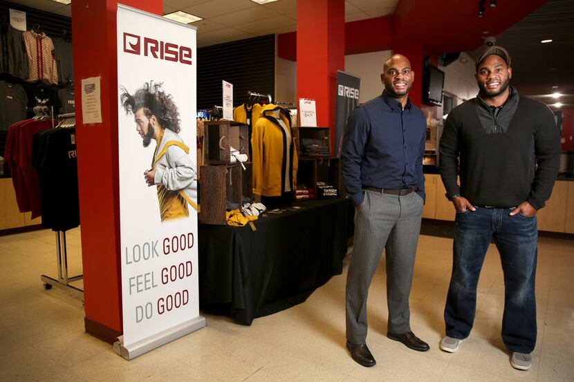 Tim Maiden (left) and Terrence Maiden stand in front of their RISE apparel store at the...
