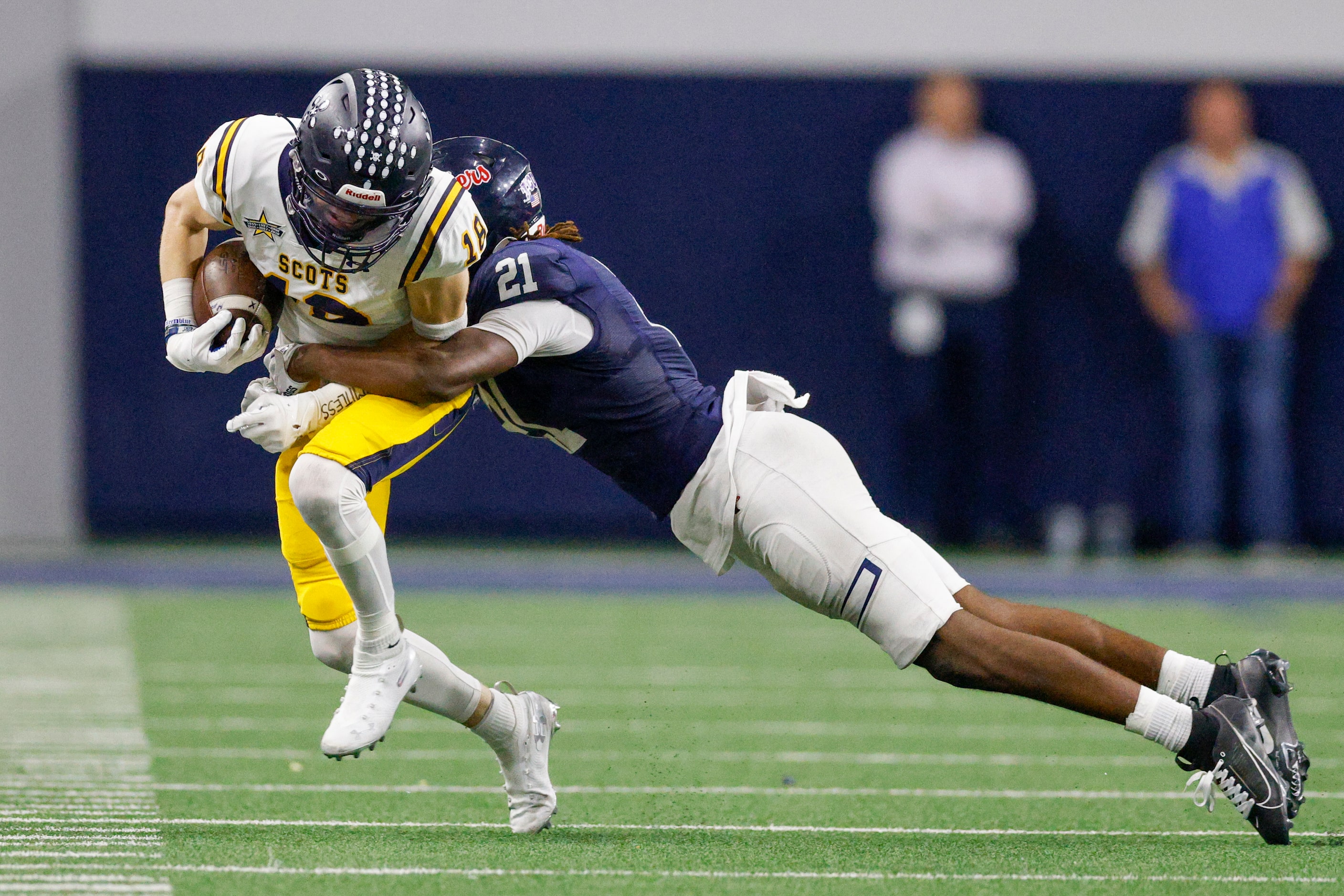 Denton Ryan linebacker Dillon Arkansas (21) tackles Highland Park wide receiver Brandon...