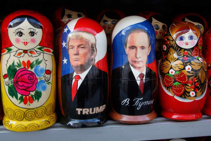 Traditional Russian wooden dolls called Matryoshka depicting Russian President Vladimir...
