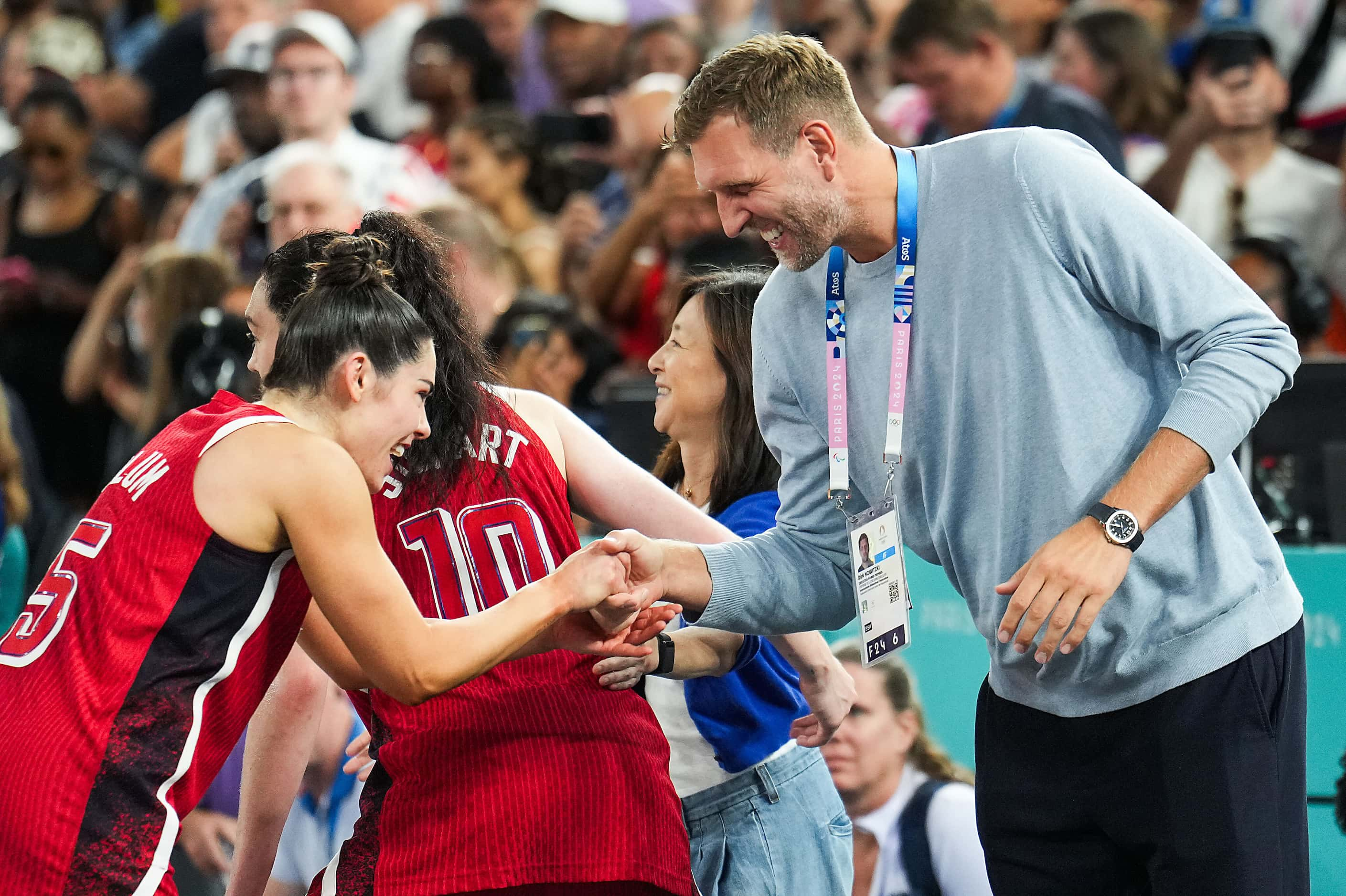 Kelsey Plum (5) of the United States is congratulated by Dirk Nowitzki after a victory over...