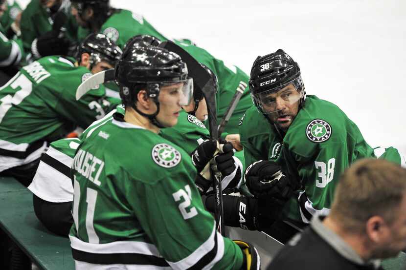 Dallas Stars center Vernon Fiddler (second right) along with the rest of the Stars bench...