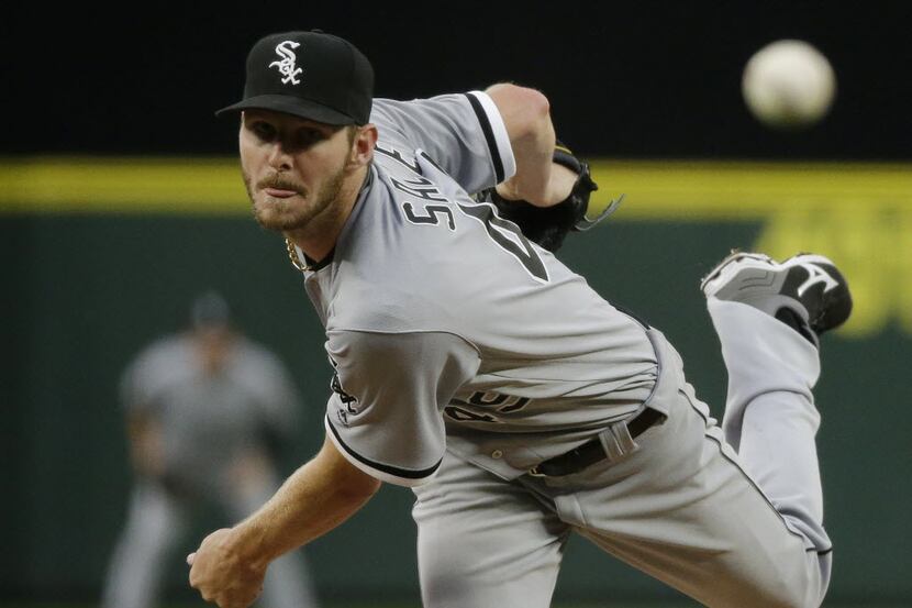 Chicago White Sox starting pitcher Chris Sale throws against the Seattle Mariners in the...