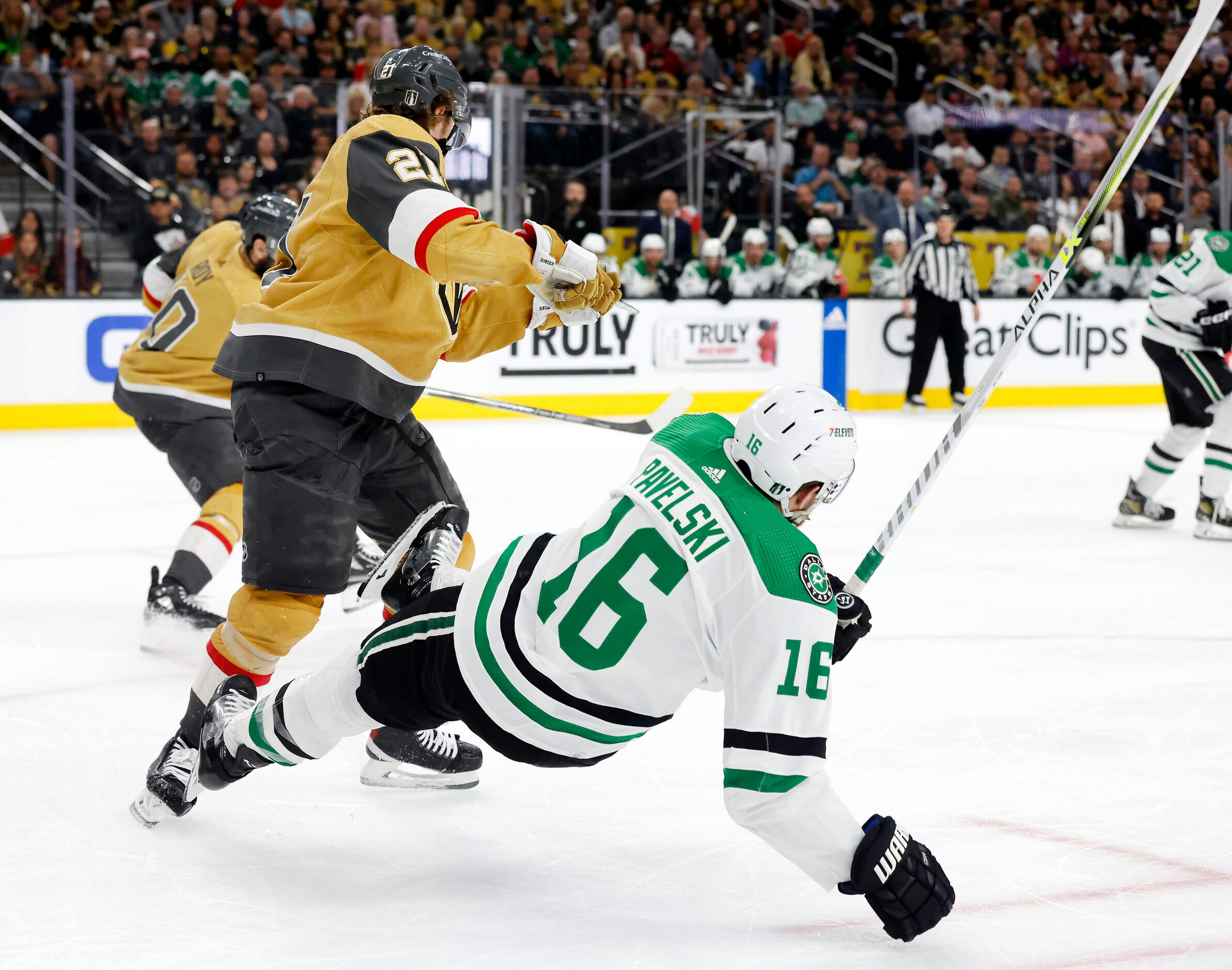 Dallas Stars center Joe Pavelski (16) is sent flying as he’s hit by Vegas Golden Knights...