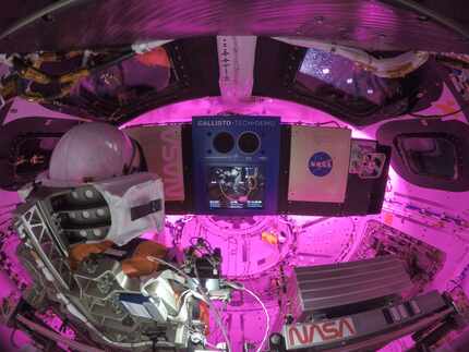 On the ninth day of the flight, the inside of Orion shows the display of the Callisto payload. 