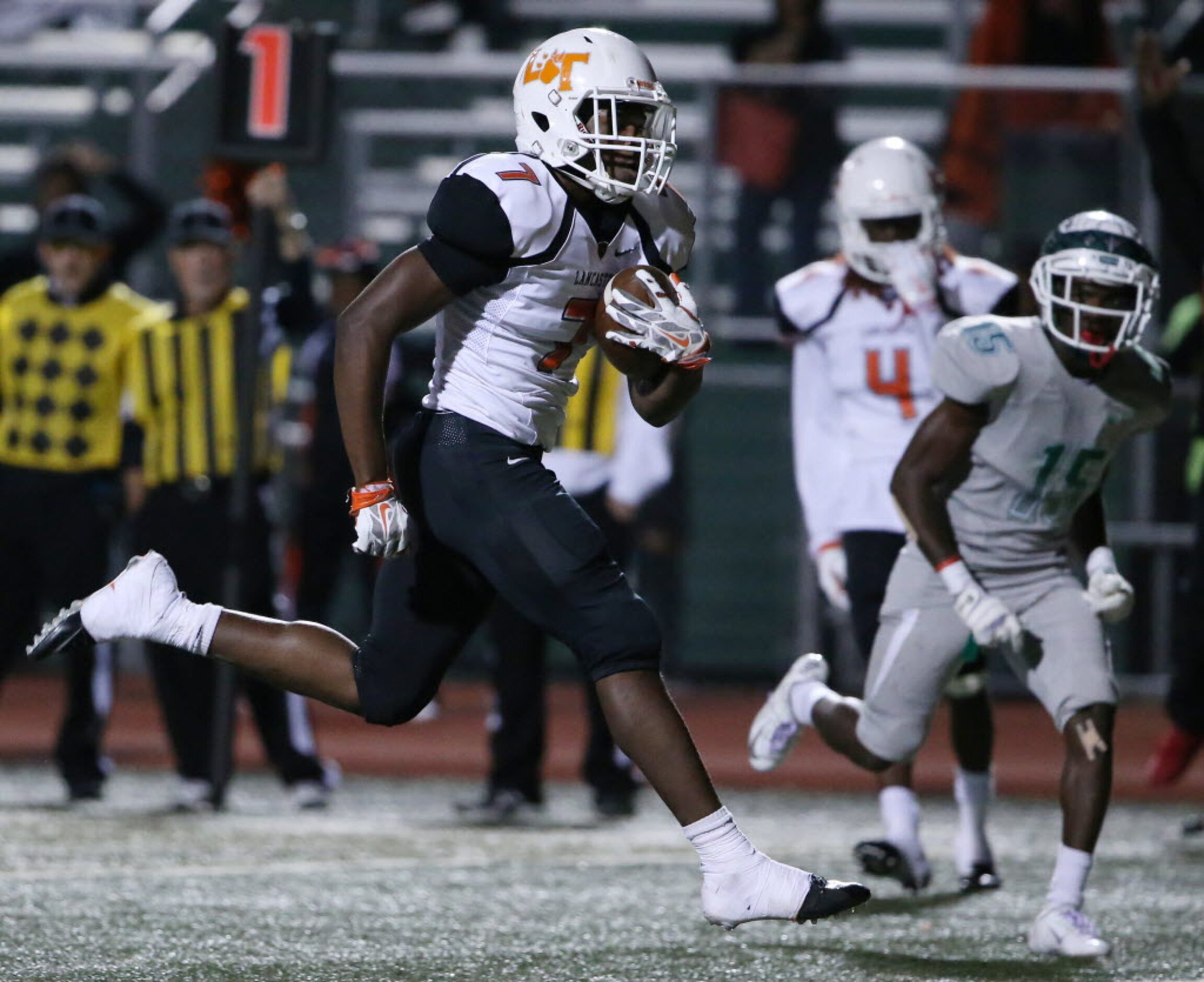 Lancaster running back Spencer Gilbert (7) rushes for a touchdown to make the score 18-27 in...