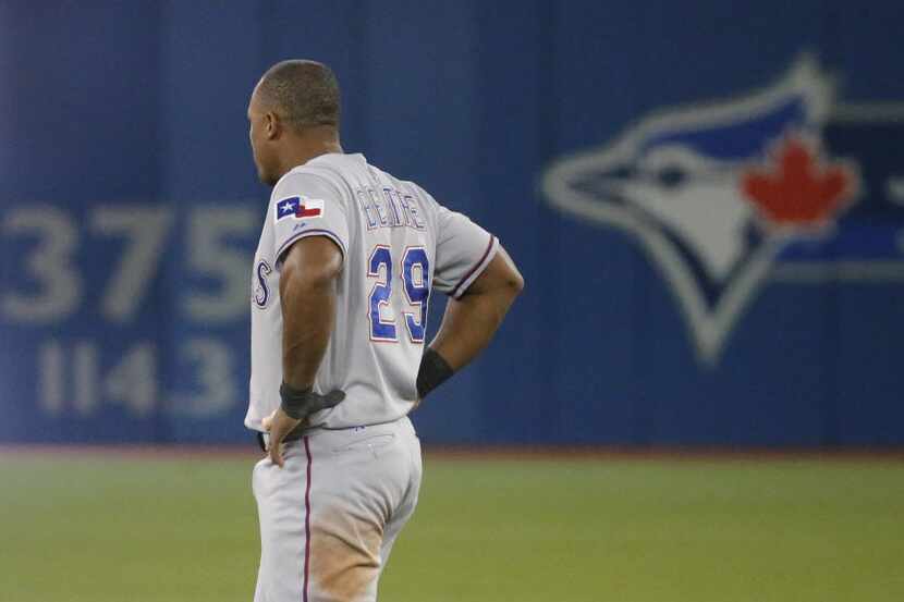 Texas Rangers third baseman Adrian Beltre (29) tries to deal with his back pain after the...